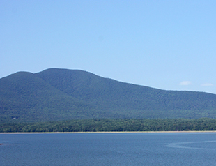 Photo of a hill with open water in front
